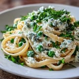 Bright, creamy Spring Pasta with ricotta, lemon zest, and sweet peas, tossed with al dente linguine for a light vegetarian meal.