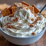 Three-ingredient cheesecake dip served with crisp graham crackers for easy dunking and snacking.  